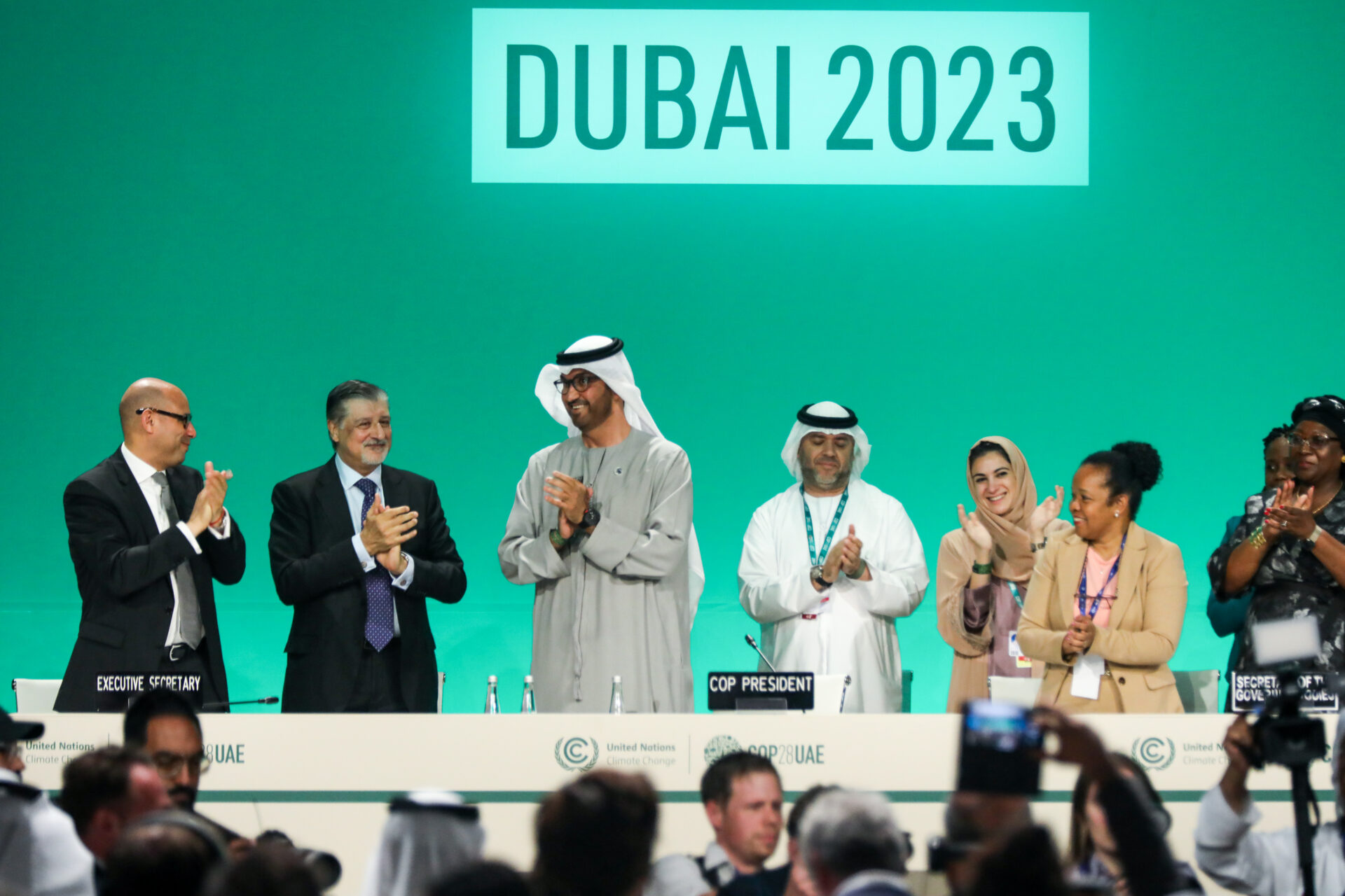 Delegates applaud after a speech by Dr. Sultan Al Jaber (3L), President of the UNFCCC COP28 Climate Conference, during a plenary session on day thirteen of the COP28 Climate Conference on December 13, 2023 in Dubai. (Photo by Fadel Dawod/Getty Images)
