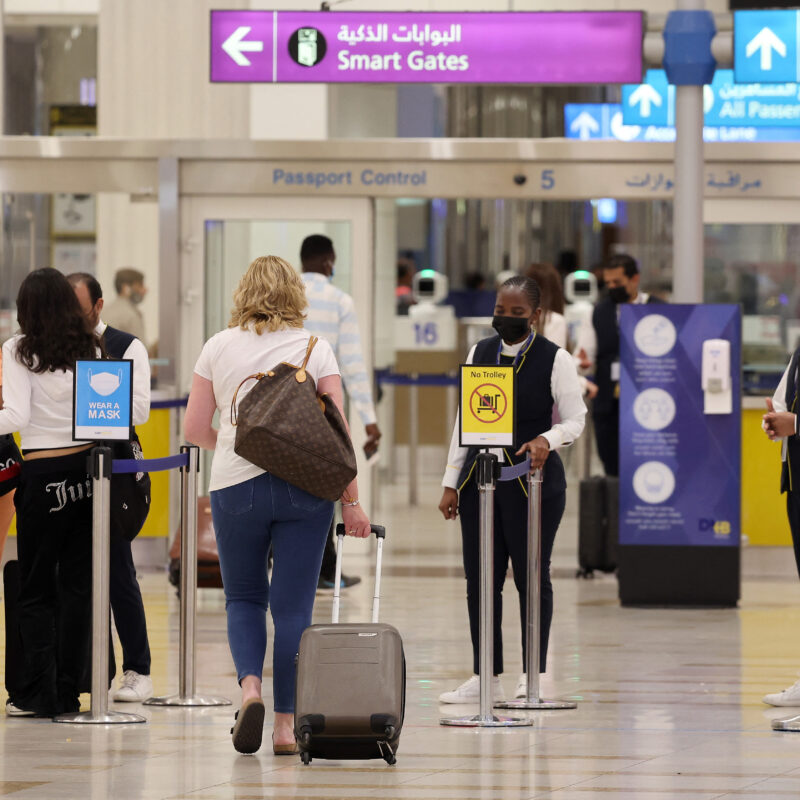 Passengers arrive at Dubai international Airport. (AFP via Getty Images)