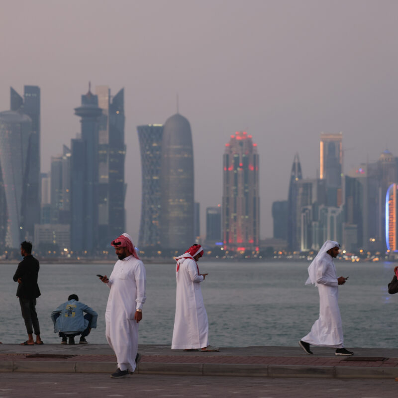 People gather at the Corniche promenade in Doha, which will host Web Summit Qatar this week. (Photo: Getty Images)