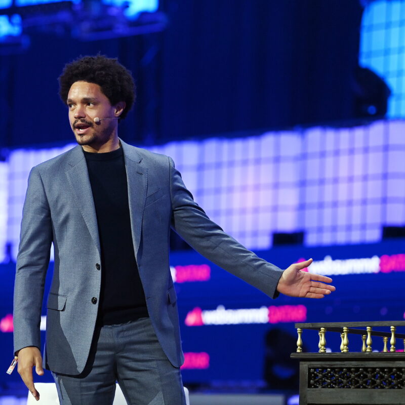 Trevor Noah appears onstage at Web Summit Qatar. (Photo: Getty Images)