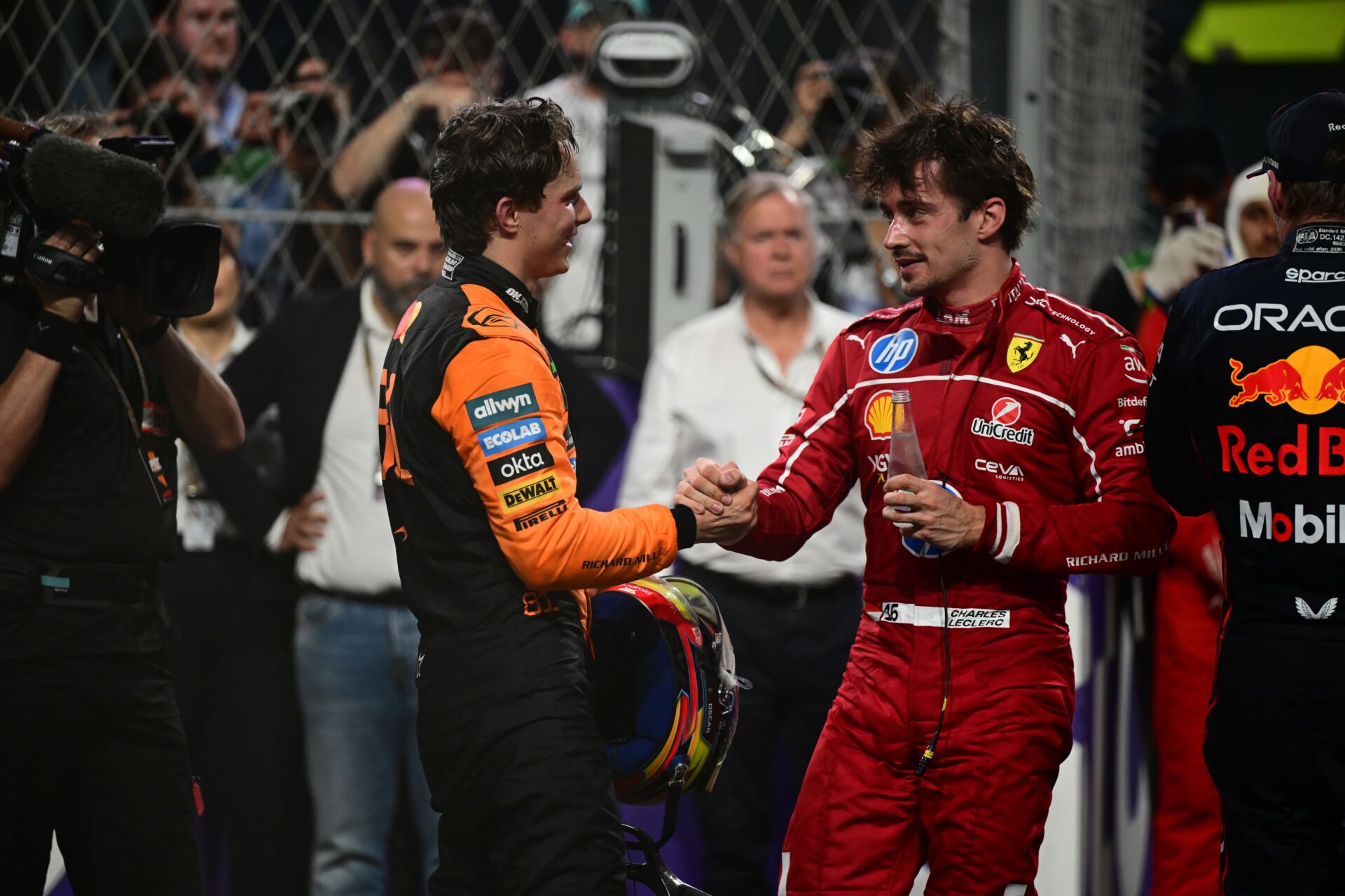 Australian driver Oscar Piastri of the McLaren F1 Team and Monegasque Charles Leclerc of Scuderia Ferrari celebrate on the podium after the Saudi Arabia GP at the Jeddah Corniche Circuit on Sunday. Piastri secured his second consecutive win on what is considered the fastest street circuit on the F1 calendar. (Andrea Diodato/NurPhoto via Getty Images)