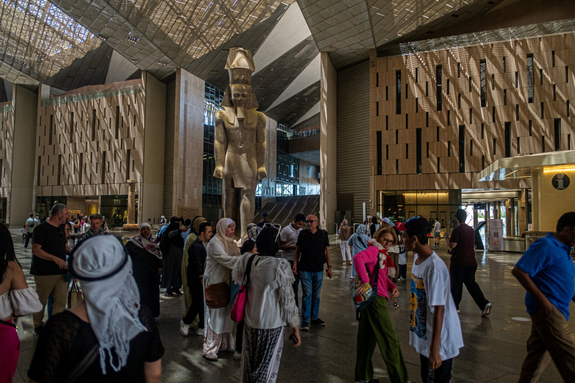 Visitors tour the new Grand Egyptian Museum in Giza on the outskirts of Cairo. The museum has started welcoming guests after years of delays, with an official opening scheduled for July. (Khaled Desouki / AFP via Getty Images)