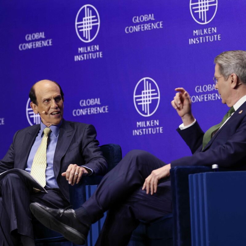U.S. Secretary of the Treasury Scott Bessent and Michael Milken, Chairman of the Milken Institute, speak at the 28th annual Milken Institute Global Conference at the Beverly Hilton in Beverly Hills, California on Monday. (Patrick T. Fallon / AFP via Getty Images)