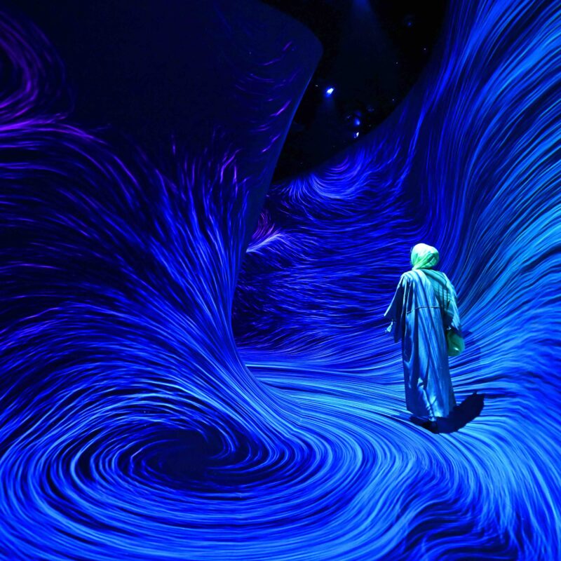 A woman visits the newly opened teamLab Phenomena, an immersive art experience museum newly opened in Abu Dhabi’s Saadiyat Cultural District. (Giuseppe Cacace /AFP via Getty Images)