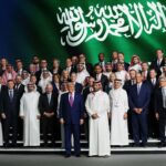 U.S. President Donald Trump and Saudi Crown Prince Mohammed bin Salman pose for a photo with business leaders including Nvidia CEO Jensen Huang and Alphabet chief investment officer Ruth Porat at the King Abdul Aziz International Conference Center while attending a Saudi-U.S. business investment forum in Riyadh on Tuesday. (Win McNamee/Getty Images)