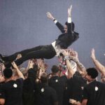 Players lift Paris Saint Germain's Qatari president Nasser al-Khelaifi up in the air as they celebrate during a trophy ceremony a day after the football club won the UEFA Champions League, at the Parc des Princes Stadium in Paris on Sunday. (Thibaud Moritz AFP via Getty Images)