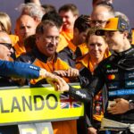 Prince Salman bin Hamad Al Khalifa, Bahrain’s Crown Prince and Prime Minister, greets Oscar Piastri of Australia and team McLaren in the pit lane during Britain’s F1 Grand Prix at Silverstone Circuit on Sunday. (Jayce Illman/Getty Images)