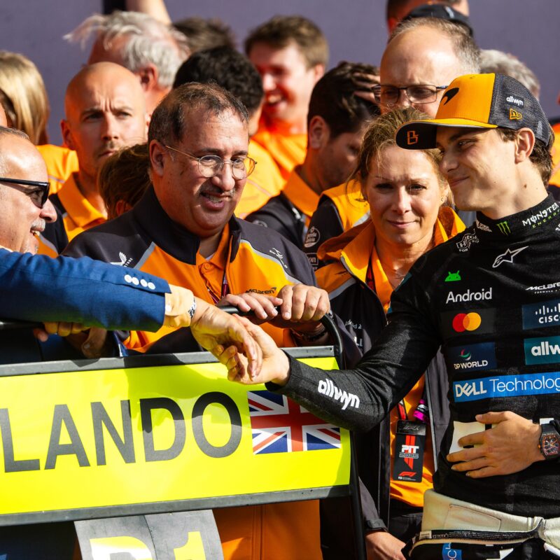 Prince Salman bin Hamad Al Khalifa, Bahrain’s Crown Prince and Prime Minister, greets Oscar Piastri of Australia and team McLaren in the pit lane during Britain’s F1 Grand Prix at Silverstone Circuit on Sunday. (Jayce Illman/Getty Images)