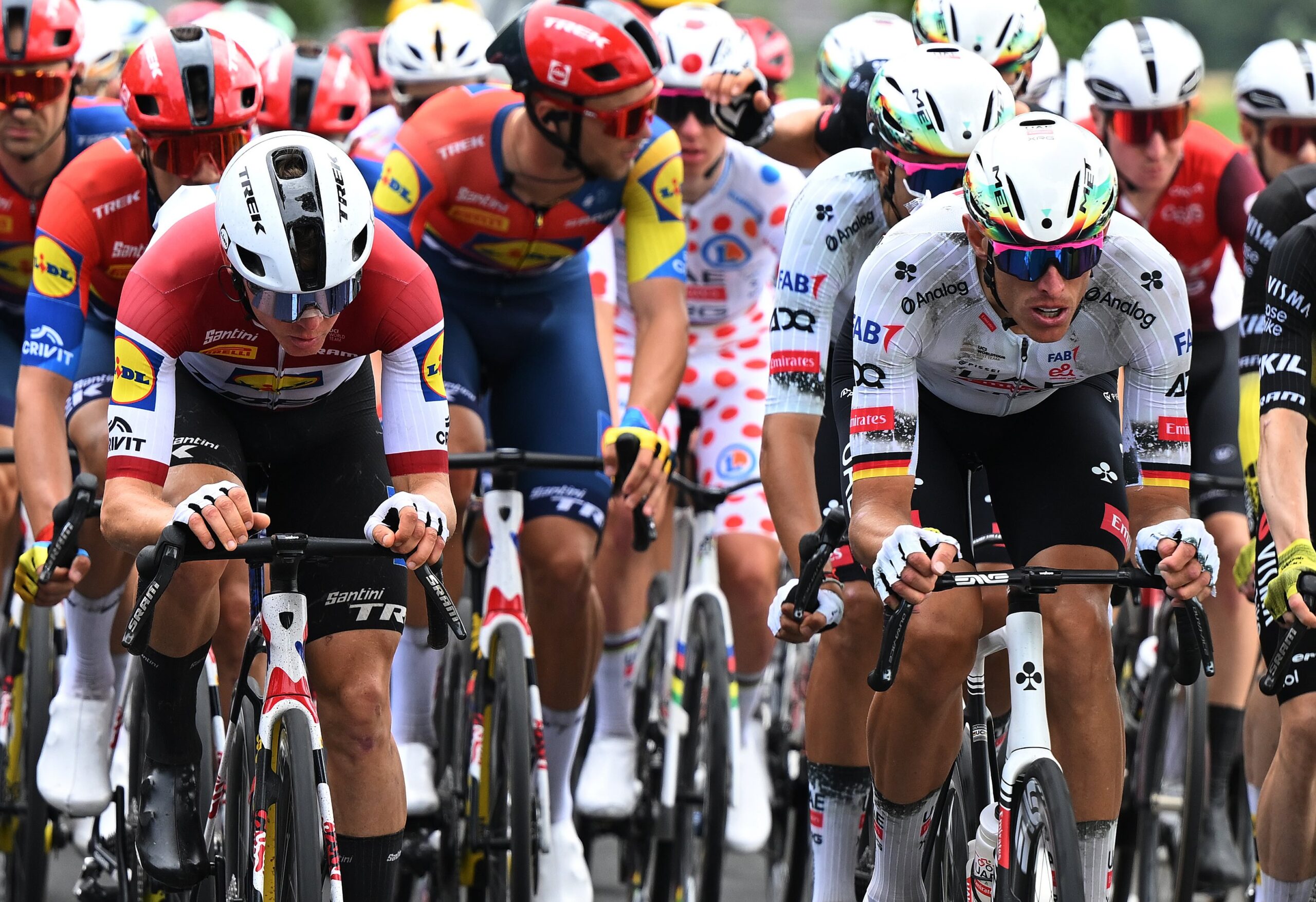 Riders from UAE Team Emirates-XRG, including German rider Nils Politt, are seen wearing the world’s first cycling helmet developed using generative AI, made by UAE AI powerhouse G42 and manufacturer MET, during the ongoing Tour de France. (Dario Belingheri/Getty Images)